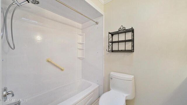 bathroom with toilet and shower / bath combination