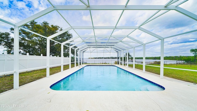 view of pool featuring a patio, a fenced backyard, a lanai, a lawn, and a fenced in pool