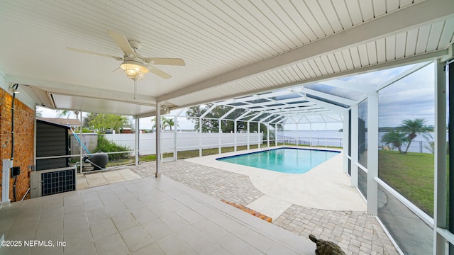 view of swimming pool featuring a ceiling fan, a fenced in pool, a fenced backyard, a lanai, and a patio area