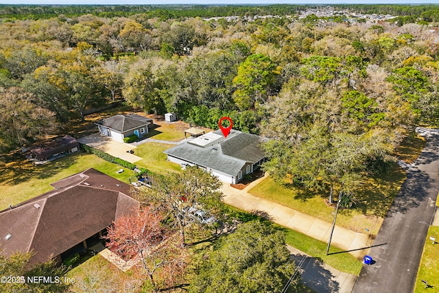 bird's eye view featuring a view of trees