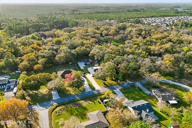 aerial view featuring a residential view and a forest view