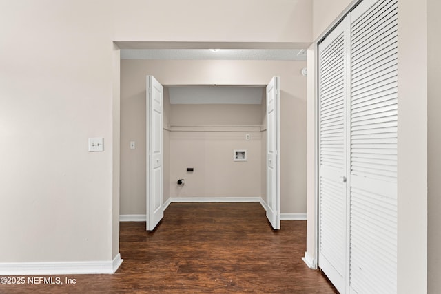 laundry area featuring dark wood finished floors, hookup for a washing machine, hookup for an electric dryer, laundry area, and baseboards