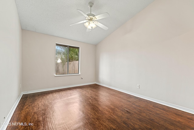 unfurnished room featuring a textured ceiling, wood finished floors, a ceiling fan, baseboards, and vaulted ceiling