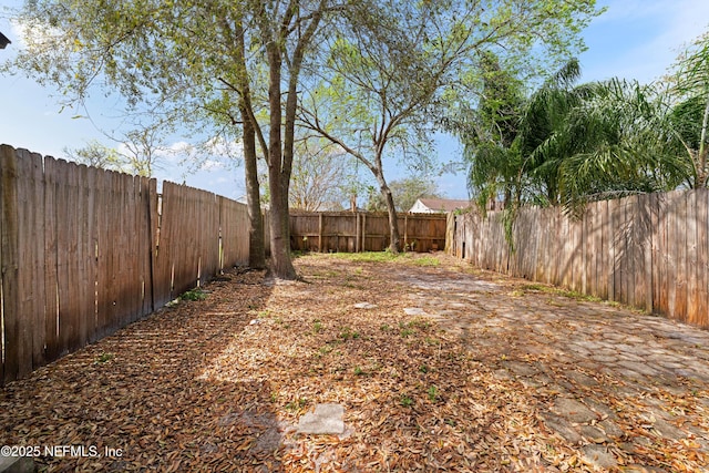 view of yard with a fenced backyard