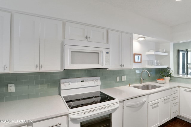 kitchen featuring open shelves, backsplash, white cabinets, a sink, and white appliances