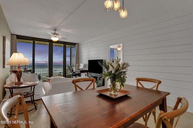 dining room with ceiling fan and floor to ceiling windows