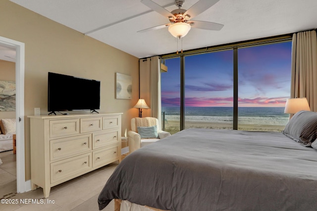 bedroom with a ceiling fan and light tile patterned flooring