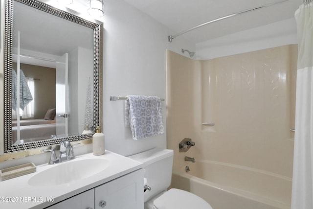 bathroom featuring toilet, shower / bath combo, vanity, and ensuite bathroom