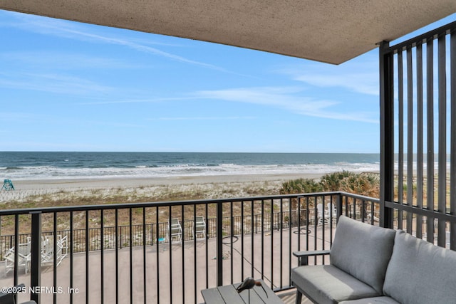 balcony with a view of the beach and a water view