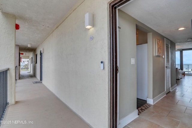 hall featuring tile patterned floors