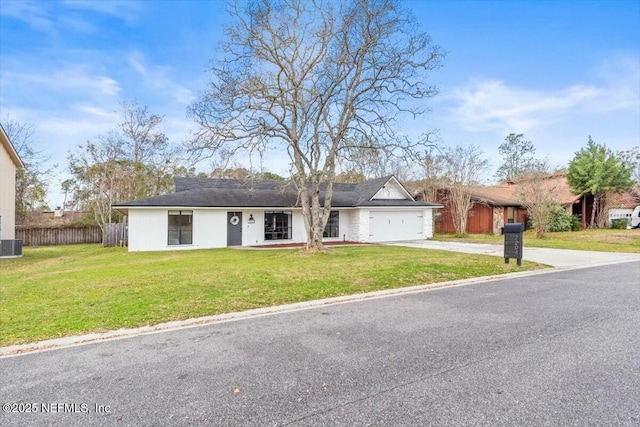 2204 Chablis Ct W, Orange Park, FL 32073 - ranch-style house with an attached garage, driveway, a front yard, and fence