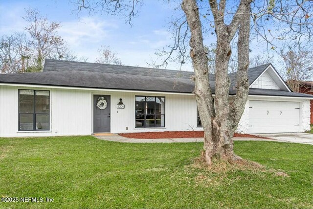 2204 Chablis Ct W, Orange Park, FL 32073 - view of front of home with concrete driveway, an attached garage, and a front lawn