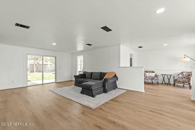 2204 Chablis Ct W, Orange Park, FL 32073 - living area featuring light wood-style floors, recessed lighting, visible vents, and ornamental molding