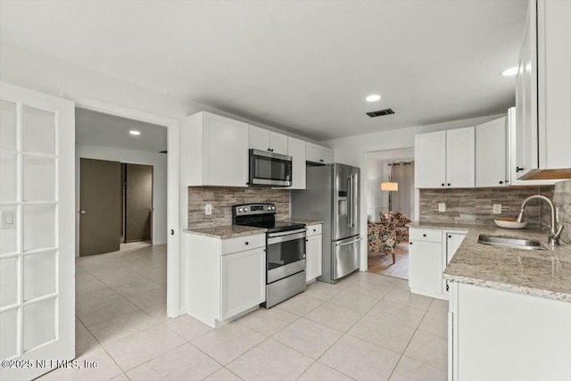 2204 Chablis Ct W, Orange Park, FL 32073 - kitchen featuring light tile patterned floors, visible vents, stainless steel appliances, and a sink