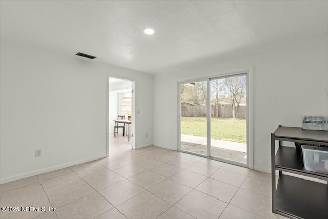 2204 Chablis Ct W, Orange Park, FL 32073 - unfurnished living room with visible vents, baseboards, and light tile patterned flooring