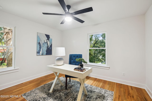 office with ceiling fan, baseboards, and wood finished floors