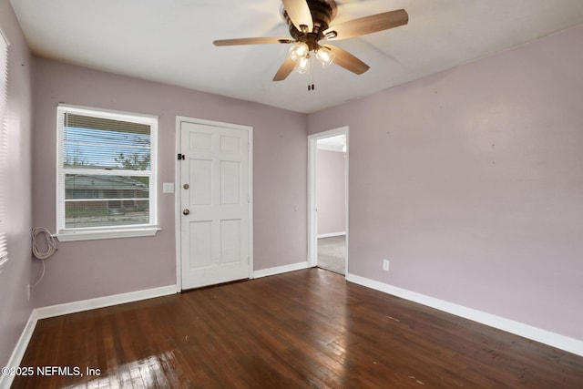 entryway featuring wood finished floors, a ceiling fan, and baseboards