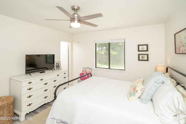 bedroom featuring a ceiling fan and wood finished floors