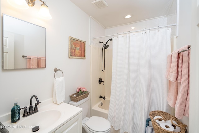 full bath with shower / tub combo, vanity, toilet, and visible vents