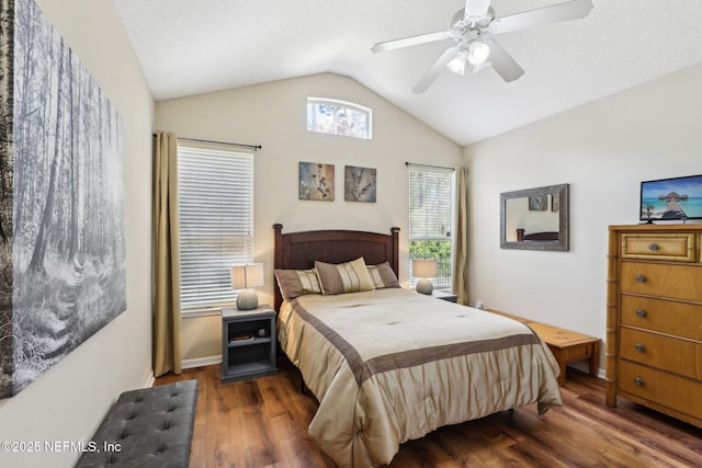 bedroom with ceiling fan, baseboards, vaulted ceiling, and wood finished floors