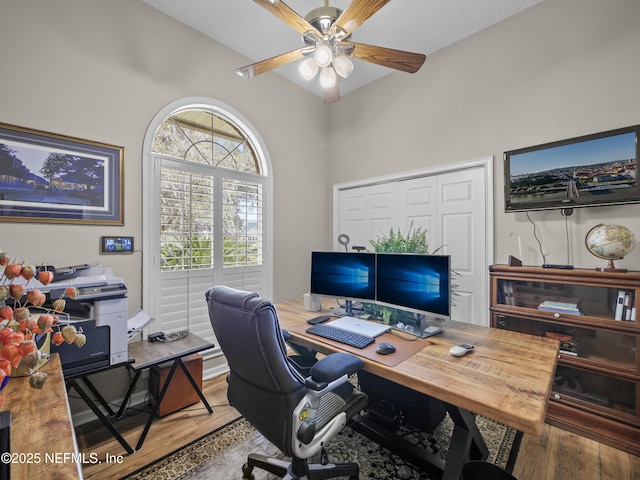 office space featuring wood finished floors and ceiling fan