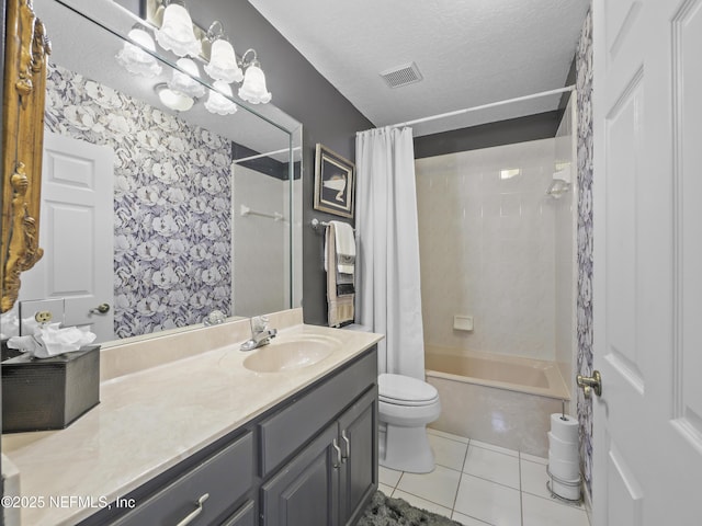 bathroom featuring visible vents, toilet, a textured ceiling, tile patterned flooring, and vanity