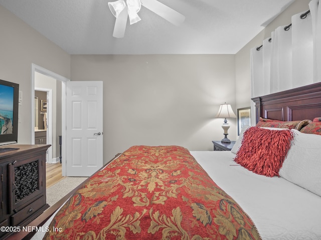 bedroom with ceiling fan and light wood-style flooring