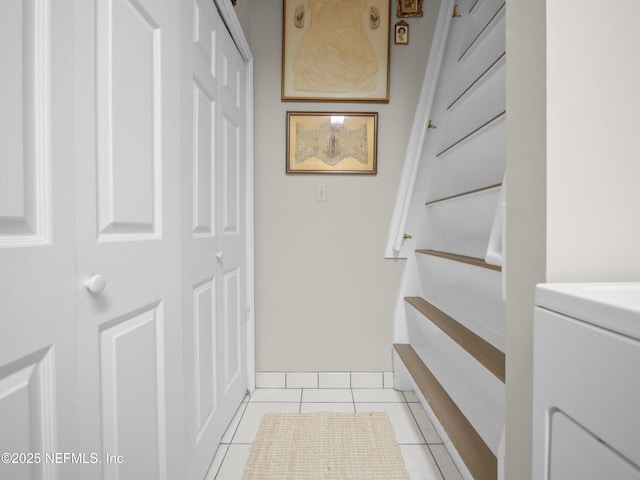 interior space featuring tile patterned flooring and washer / dryer