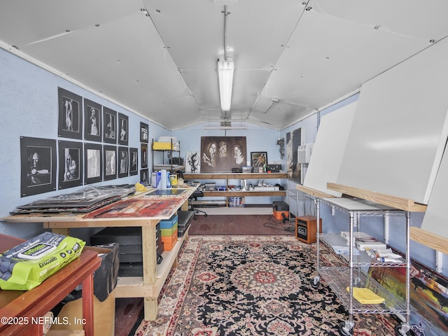 misc room featuring lofted ceiling and concrete floors