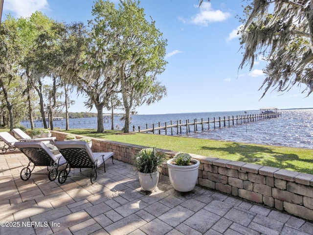 view of patio with a water view