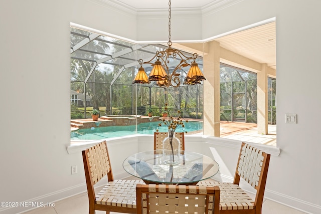 dining room with a sunroom, baseboards, and crown molding