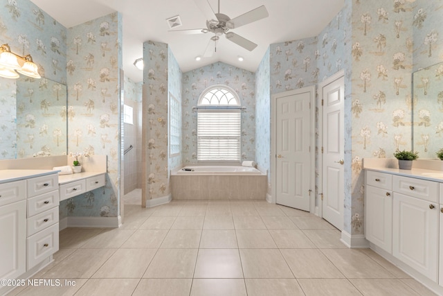 bathroom featuring vaulted ceiling, tile patterned flooring, a garden tub, and wallpapered walls