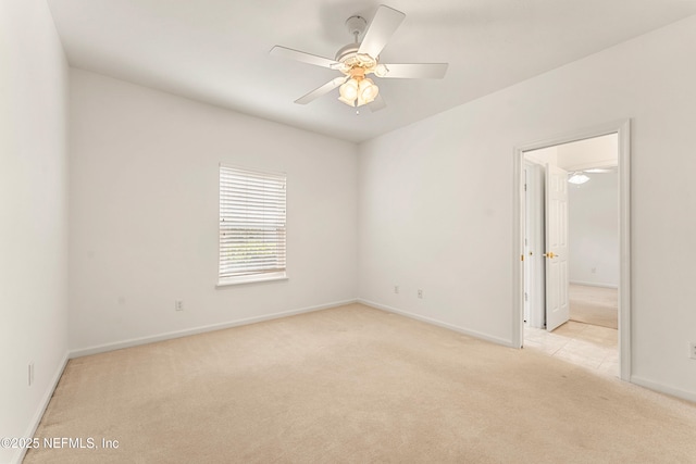 unfurnished room with ceiling fan, baseboards, and carpet flooring