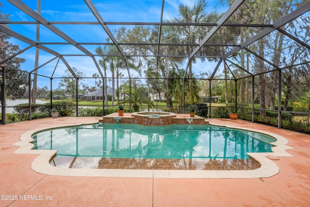 view of swimming pool featuring a lanai, a patio area, and a pool with connected hot tub