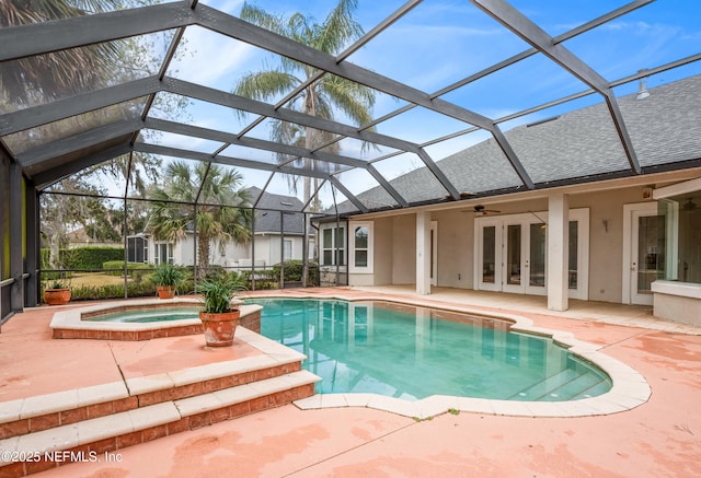 pool featuring a lanai, an in ground hot tub, a patio, and french doors