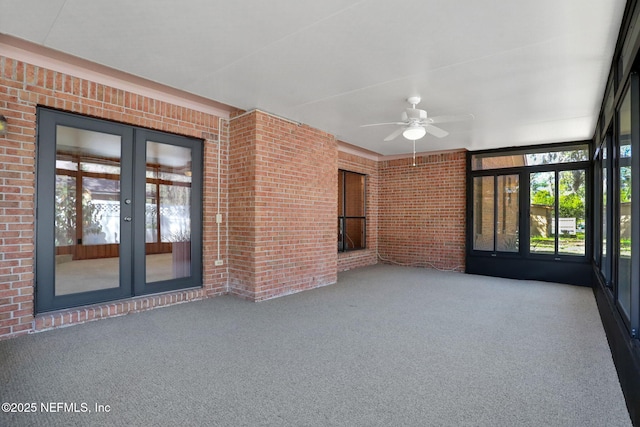 interior space featuring a ceiling fan and french doors