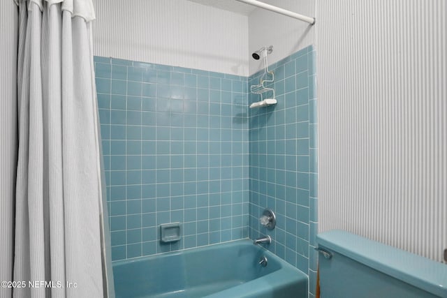 full bath featuring shower / bath combo and toilet