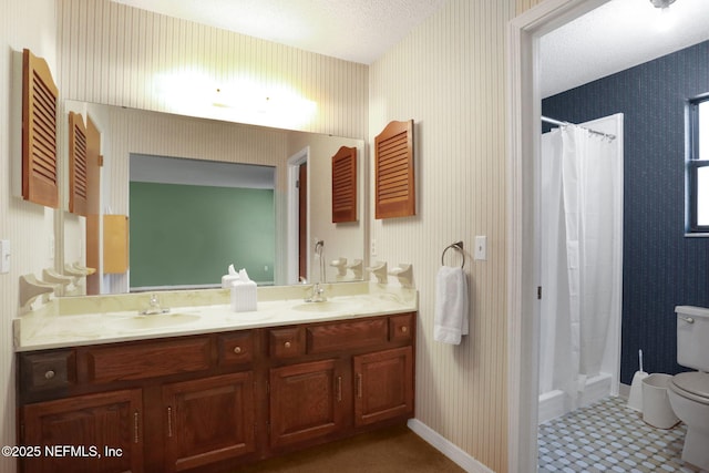 full bathroom featuring a sink, toilet, and wallpapered walls