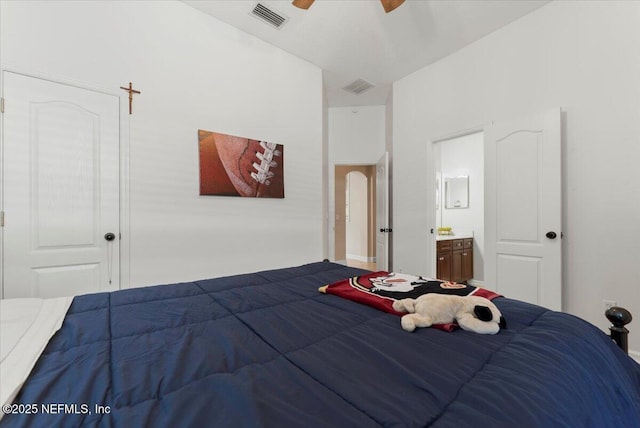 bedroom with a ceiling fan, visible vents, and ensuite bath