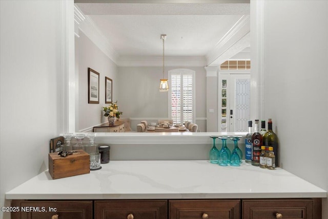 bathroom with crown molding and vanity