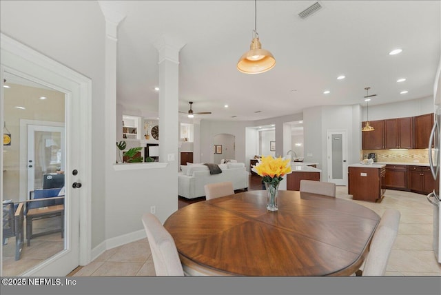 dining space featuring recessed lighting, visible vents, a ceiling fan, light tile patterned flooring, and ornate columns