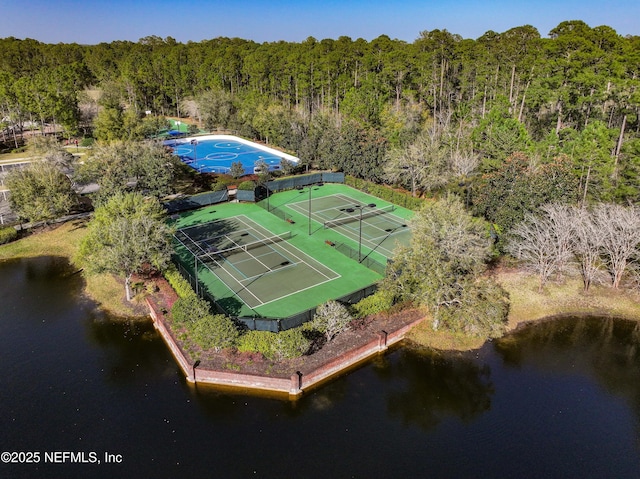 aerial view featuring a water view and a view of trees