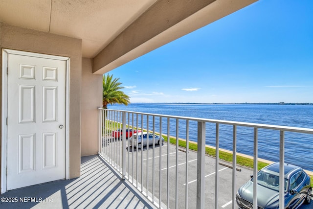 balcony featuring a water view