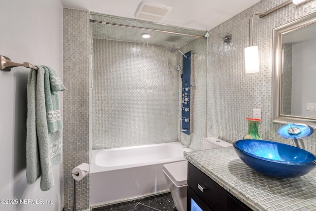 bathroom featuring shower / bath combination, vanity, and tile patterned flooring