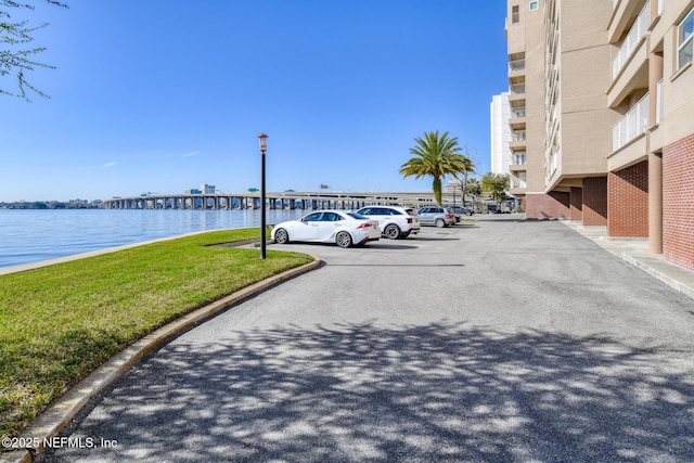 uncovered parking lot with a water view