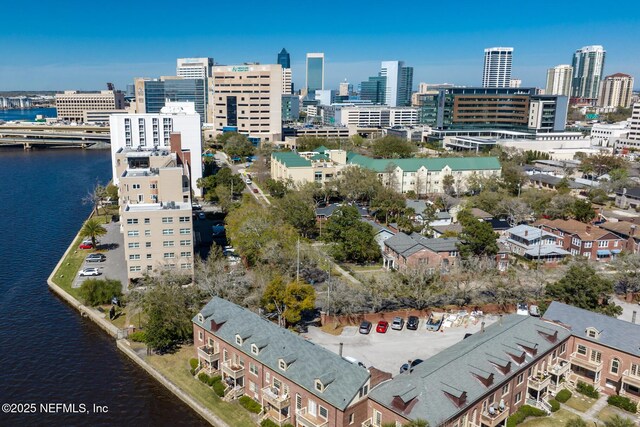 drone / aerial view featuring a water view and a city view