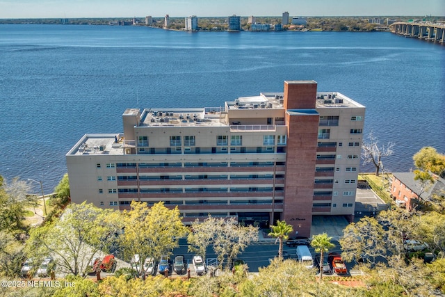 birds eye view of property featuring a water view