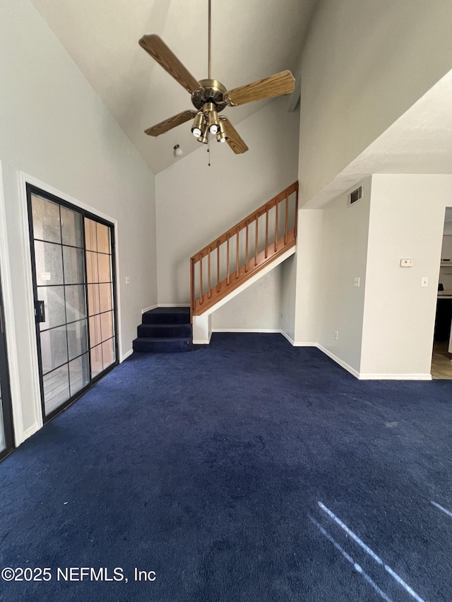 unfurnished living room featuring carpet floors, high vaulted ceiling, stairs, and visible vents