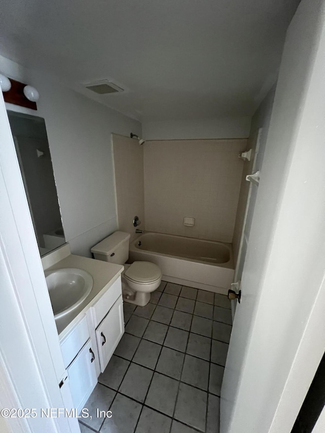 full bathroom with bathtub / shower combination, visible vents, toilet, vanity, and tile patterned flooring