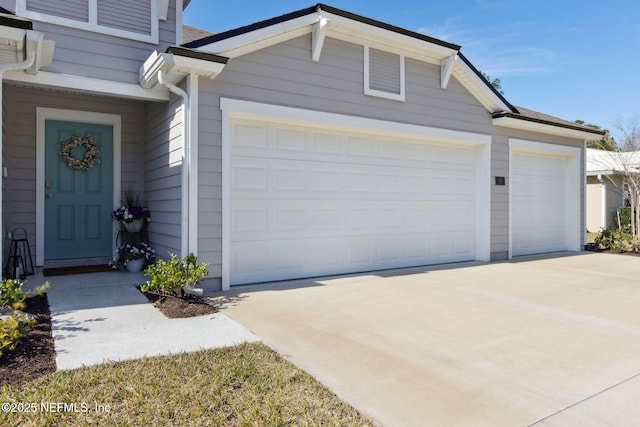 garage featuring driveway